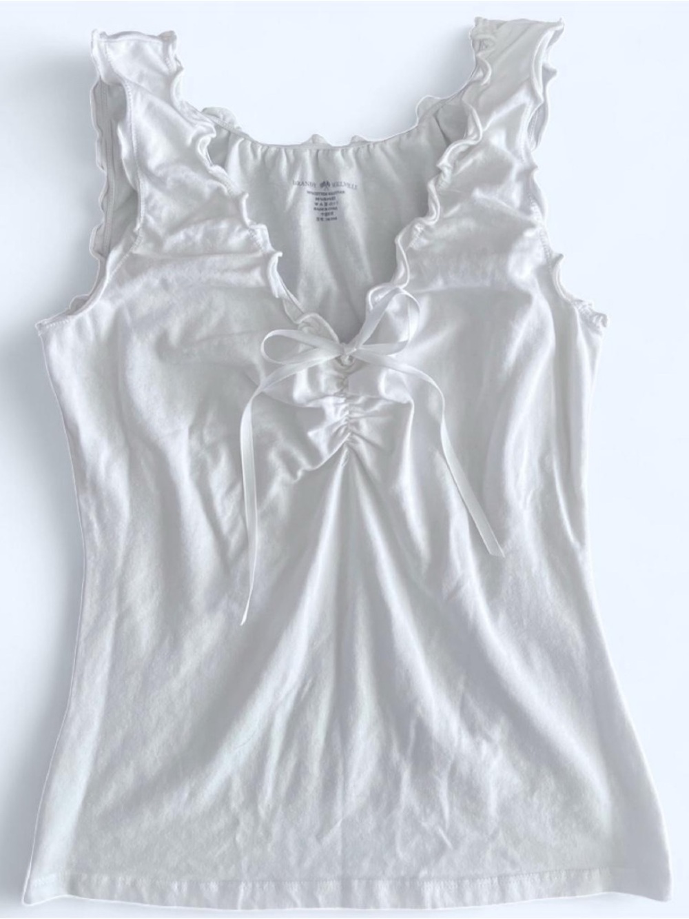 White Brandy Melville ruffle tank top with bow detail